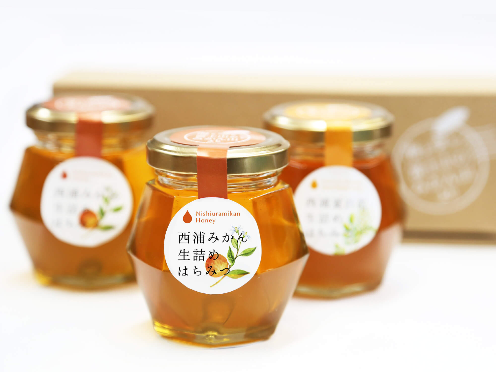 西浦みかん生詰めはちみつ・夏百花生詰めはちみつパッケージ